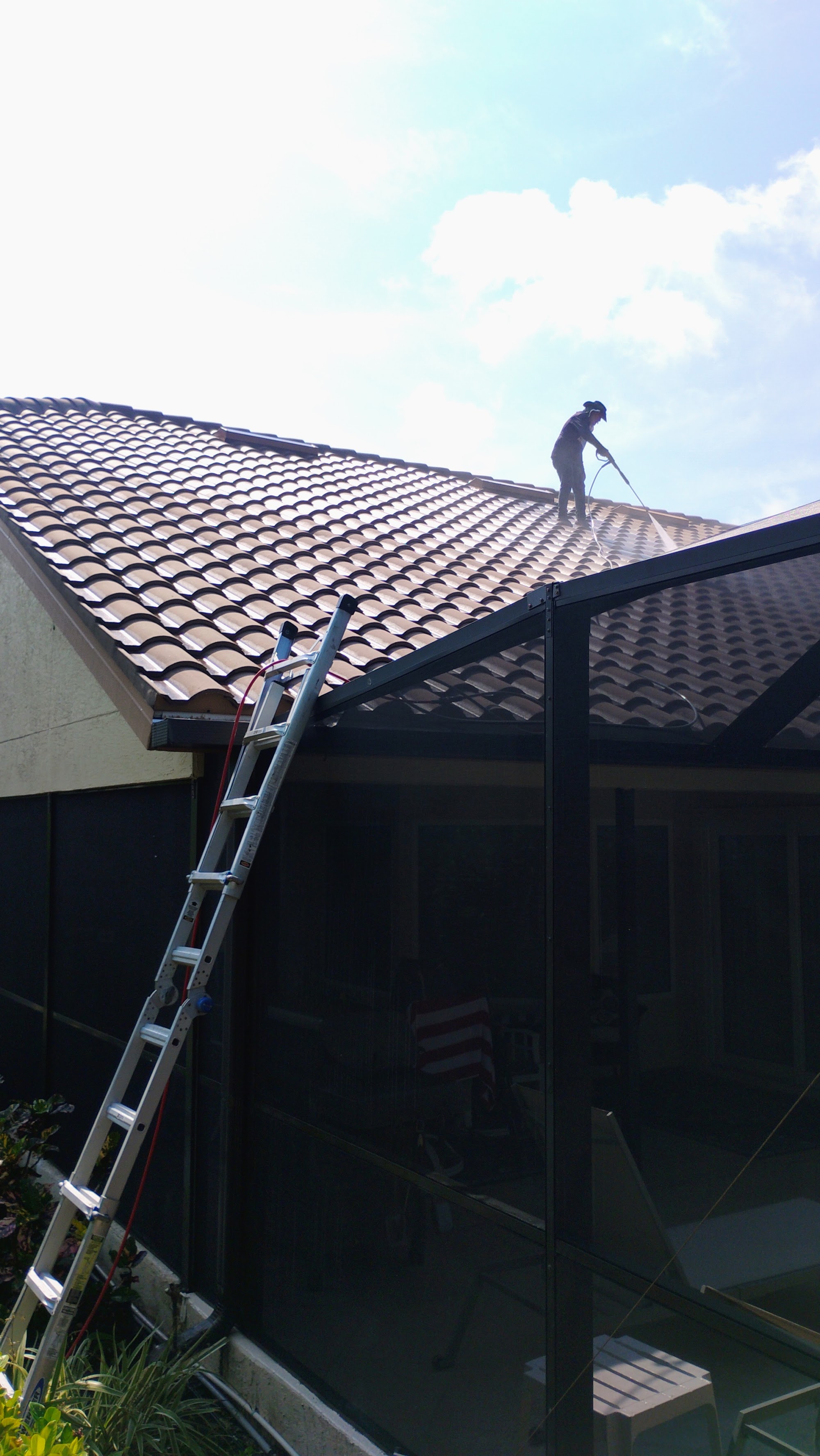 Pressure washing a tile roof
