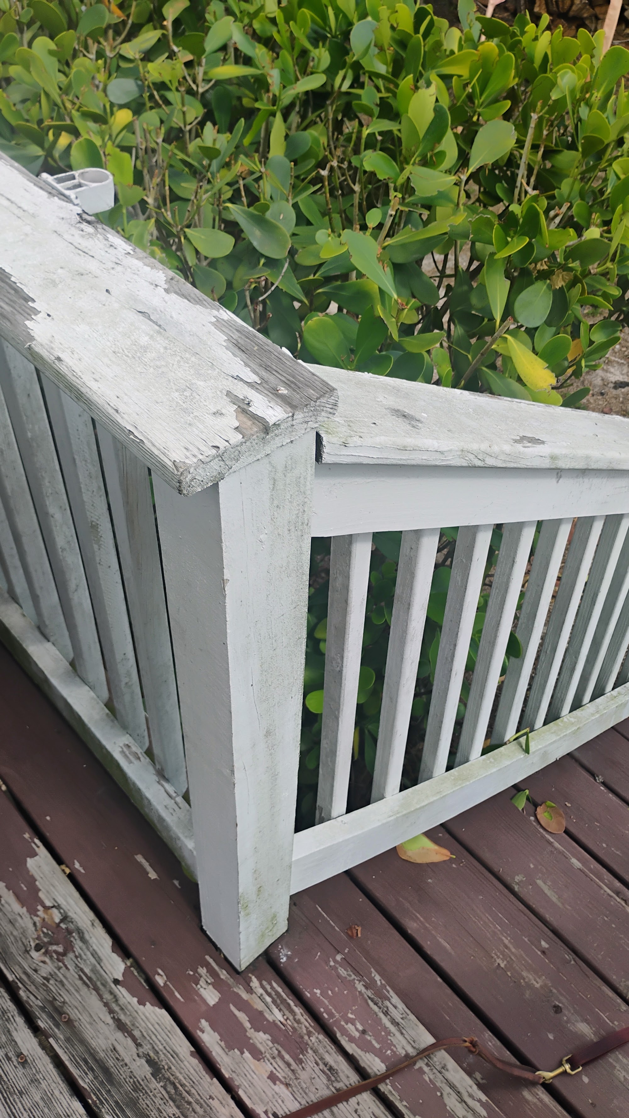Weathered deck railing before repair