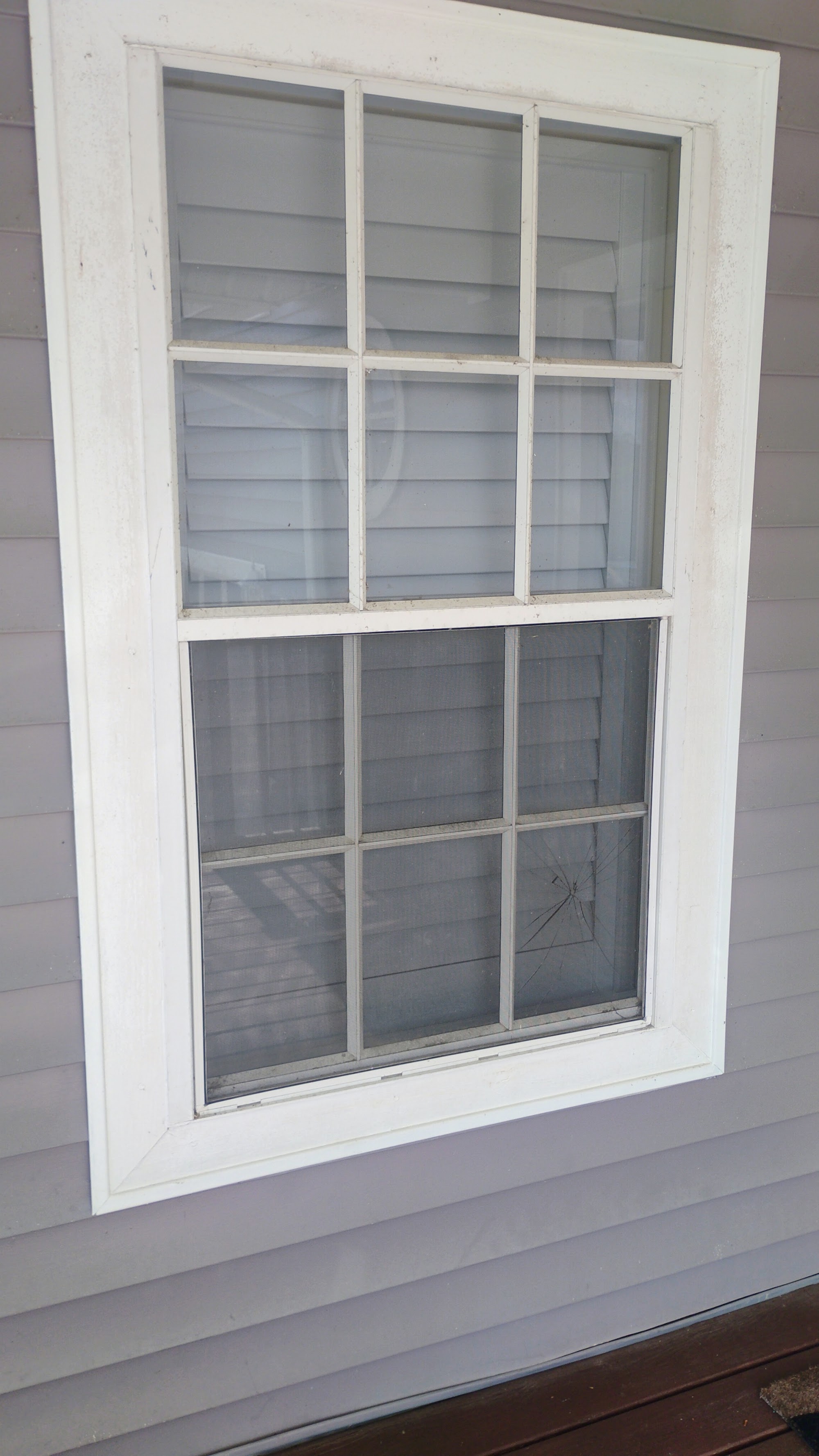 Damaged window pane before repair